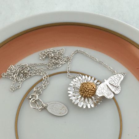 Butterfly and daisy silver necklace