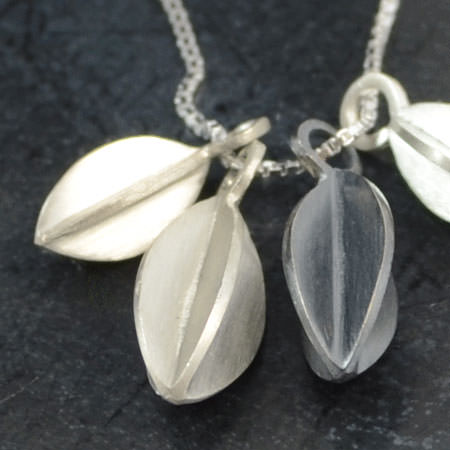 silver necklace with pods