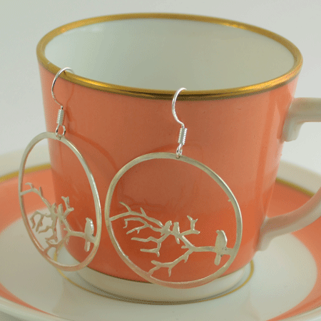 Round sterling silver earrings from Australia with birds on a branch