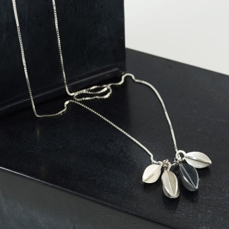 silver necklace with pods