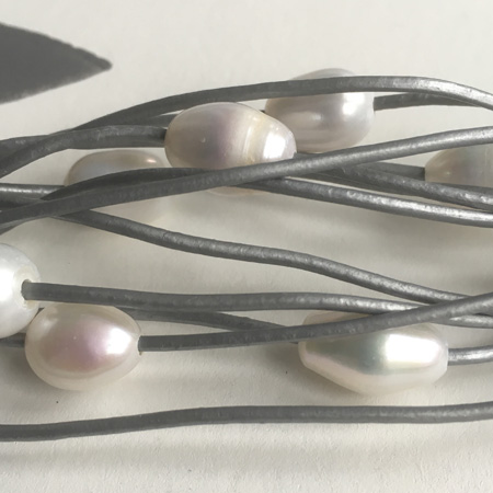 grey leather pearl bracelet close up