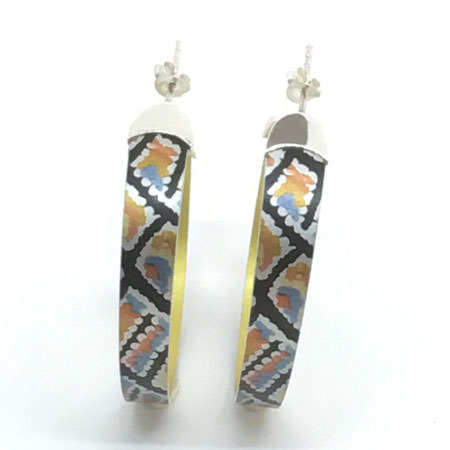 Large hoop earrings from Australia with aboriginal dreamtime painting. Colourful hoop earrings with sterling silver tips on anodised aluminium. Australian jewellery with licensed aboriginal artwork.