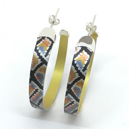 Large hoop earrings from Australia with aboriginal dreamtime painting. Colourful hoop earrings with sterling silver tips on anodised aluminium. Australian jewellery with licensed aboriginal artwork.