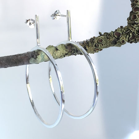 Dropped sterling silver hoops with posts.