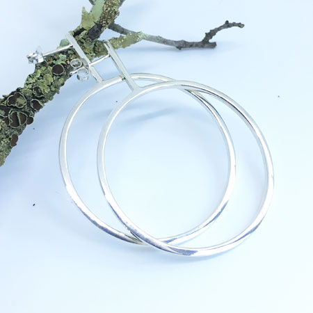 Dropped sterling silver hoops with posts.
