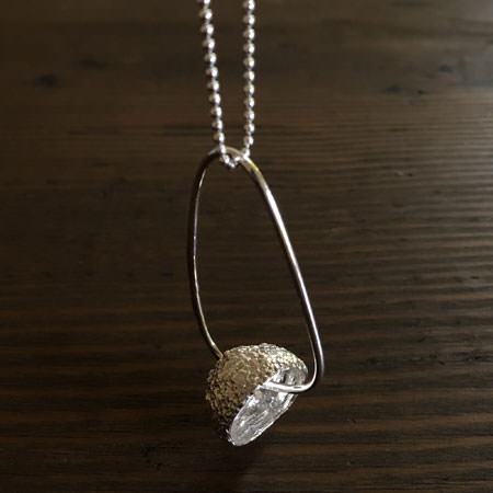 Long acorn silver pendant