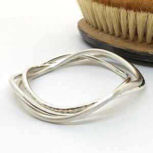 Curved silver bangles