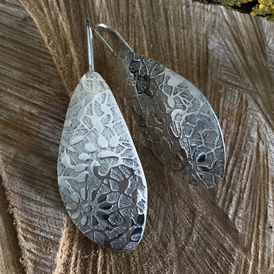 Large floral silver earrings