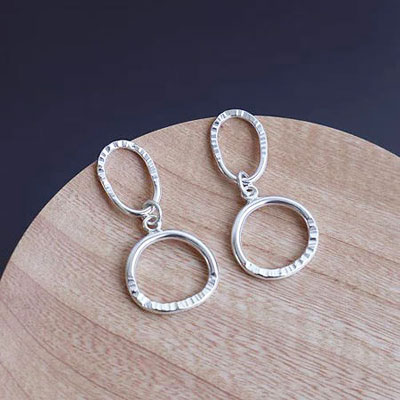 Open silver drop earrings